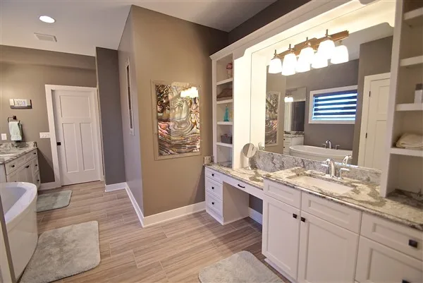Bathroom with twin mirrors, a long vanity, and tile flooring from the original Trish B Designs site.
